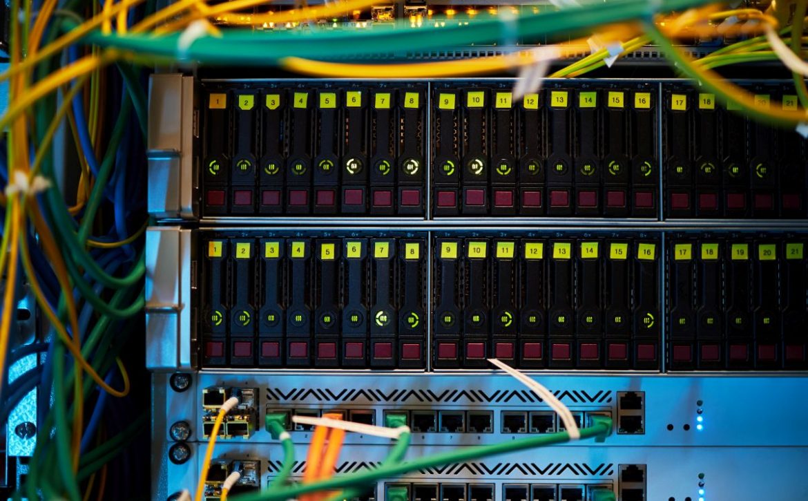 Multicolored Network Cables Connected to Server Rack